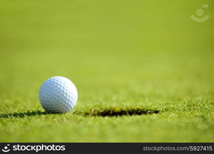 Golf ball near hole