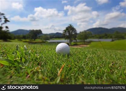Golf ball on course. Golf ball on beautiful tropical course close-up