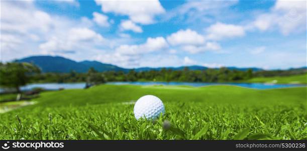Golf ball on course. Golf ball on course, beautiful landscape with mountains on background