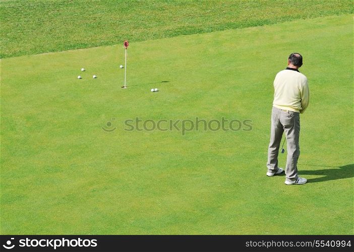 golf ball on sports golf course and hole