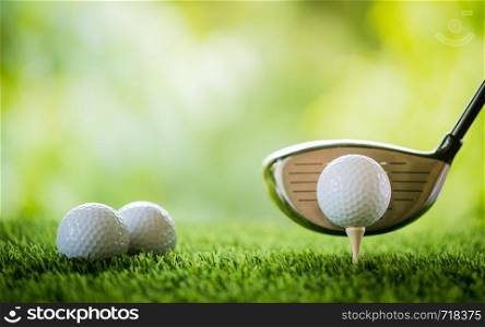 golf ball on tee with club to tee off