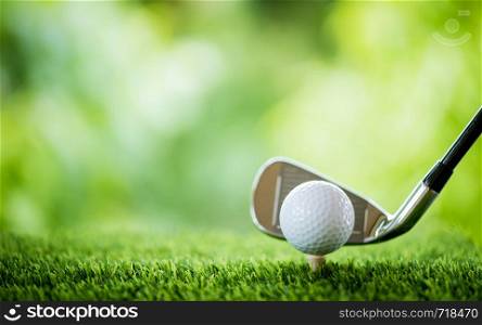 golf ball on tee with club to tee off