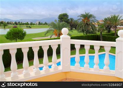 Golf course view from house with pool white balustrade