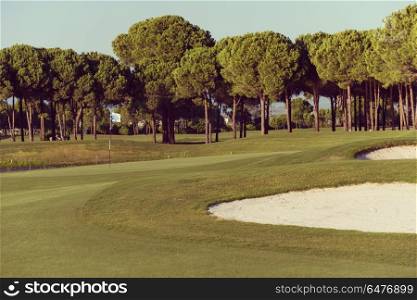 golf course with fresh green grass at beautiful sunny day. golf course on sunny day