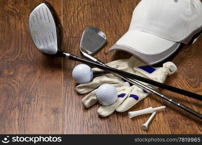 golf equipment on wooden table