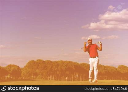 golf player hitting shot with driver on course at beautiful sunny day. golf player hitting long shot