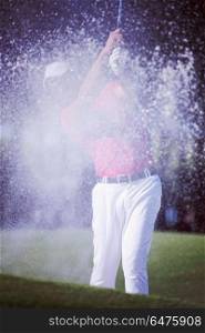 golf player shot ball from sand bunker at course. golfer hitting a sand bunker shot
