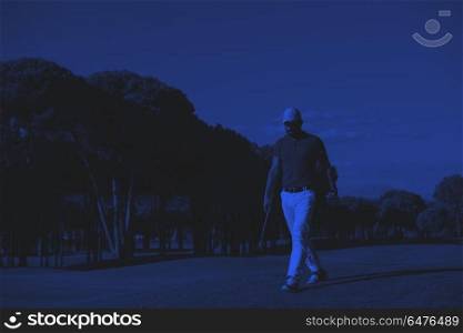 golf player walking and carrying driver. handsome middle eastern golf player carrying driver and walking at course on beautiful morning duo tone