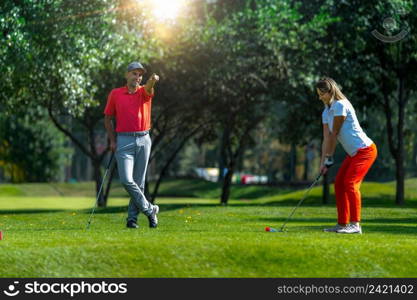 Golf vacation for couples, playing golf in a beautiful sunny weather