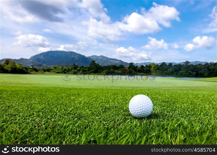 Golfball on course. Golfball on grass of golf course at sunny day