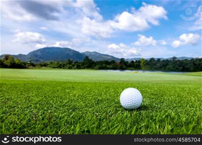 Golfball on course. Golfball on grass of golf course at sunny day