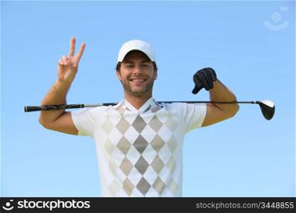 Golfer giving peace sign