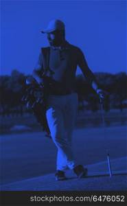 golfer portrait at golf course. handsome middle eastern golf player portrait at course at sunny day duo tone