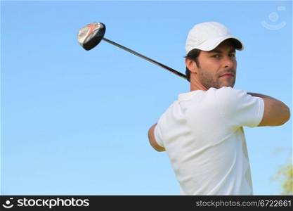 Golfer taking a swing