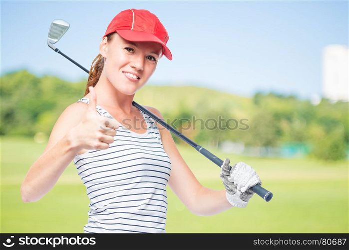 Golfer young and successful with golf club on a background of golf courses, right space