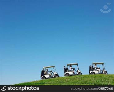Golfers Driving Carts