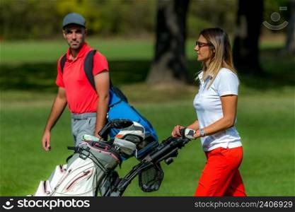 Golfing couple enjoying a game on a golf course
