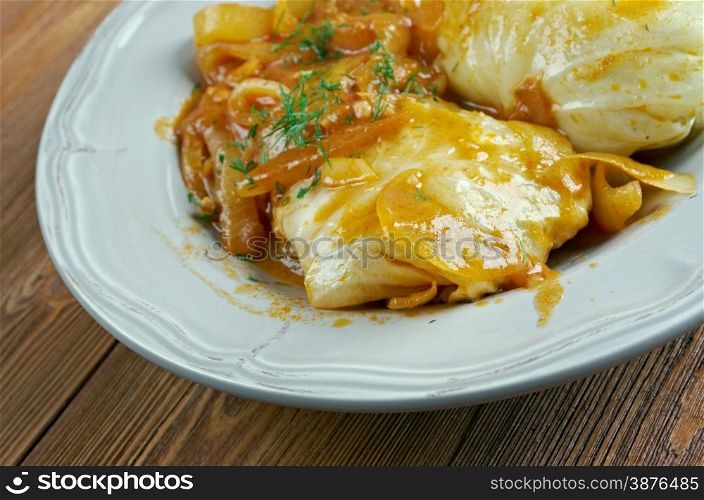 Golumpki - cabbage roll common in Polish cuisine.made from boiled cabbage leaves wrapped around minced pork or beef, chopped onions, and rice, baked in a casserole dish.