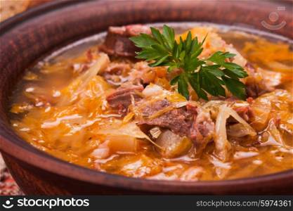 Gombaleves - Chrismtas hungarian soup with sauerkraut, sausages, mushrooms and barley