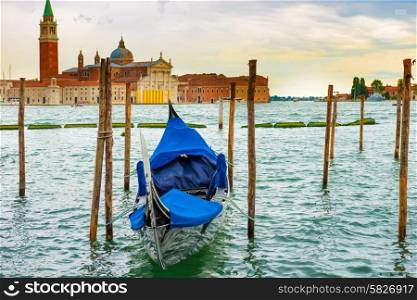 Gondola at sunset near the Piazza San Marco, Venice, Italy.