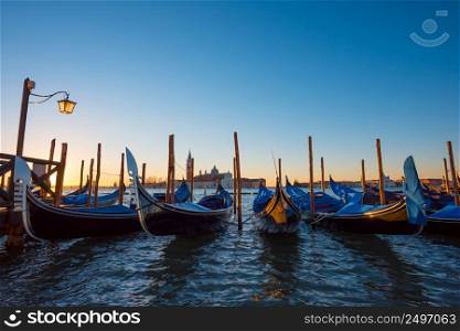 Gondola boats. Venice Italy gondola boats at seafront near San Marco square at sunrise.