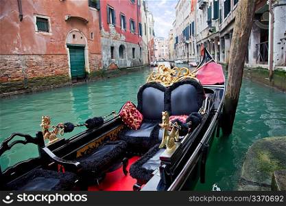 Gondola in Venice channel at the pier