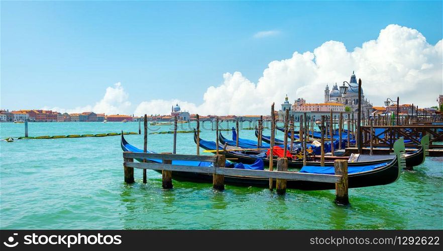 Gondolas along the Grand Canal in Venice, Italy. Gondolas along the Grand Canal