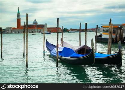 Gondolas and San Giorgio Maggiore church beyond the canal, Venice, Italy