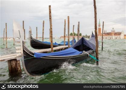 Gondolas and San Giorgio Maggiore church on Grand Canal in Venice