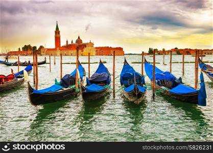 Gondolas at sunset near the Piazza San Marco, Venice, Italy.