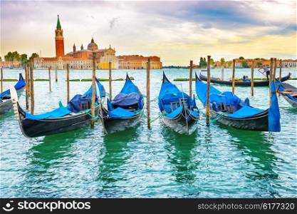Gondolas at sunset near the Piazza San Marco, Venice, Italy.