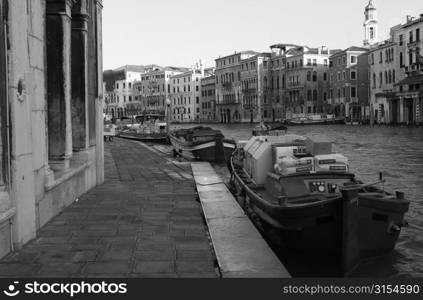 Gondolas docked at the banks of a canal in Venice, Italy