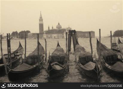 Gondolas moored at a dock, Italy