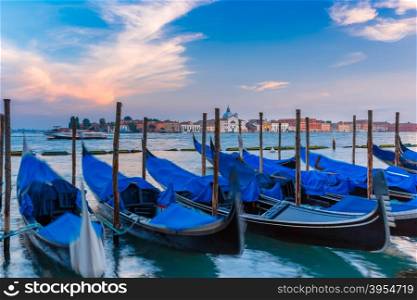 Gondolas moored by Saint Mark square in the evening, Venice lagoon, Italia