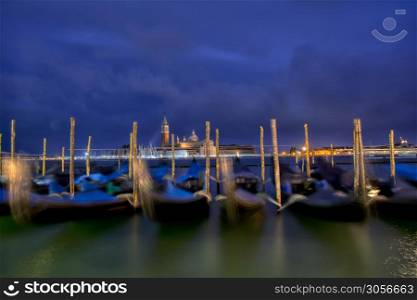 Gondolas moored by Saint Mark square on the Grand canals at dawn in Venice, Italy, Europe. Long exposure.