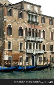 Gondolas moored on the Grand Canal, Venice, Italy