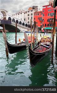 Gondolas near Rialto bridge in Venice, Italy