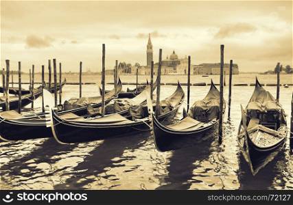 Gondolas near Saint Mark square in Venice, Italy. Black and white toned image