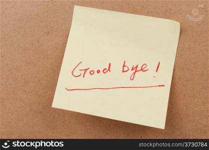Good bye words written on sticky note and attached on the board