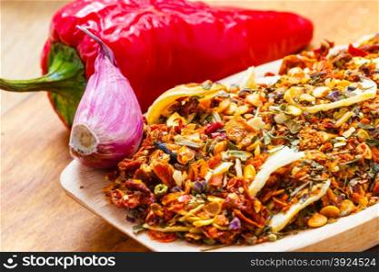 Good cuisine. Closeup colored spices for pasta mix cooking ingredients on wooden spoon