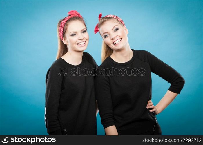 Good humor concept. Retro style and old fashion. Two smiling happy girls in red handkerchief. Women styled on pin up vintage.. Two funny positive retro styled female portrait.