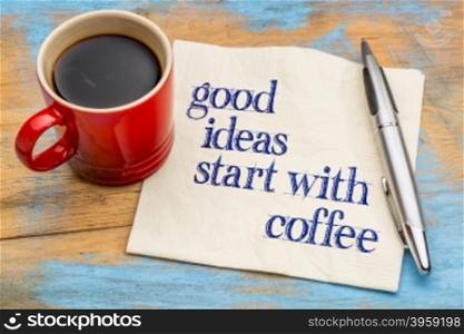 Good ideas start with coffee - handwriting on a napkin with a cup of coffee
