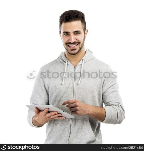 Good looking latin man working with a tablet
