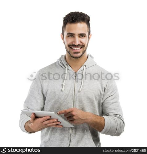 Good looking latin man working with a tablet