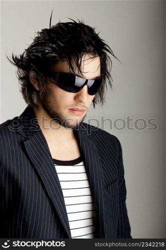 Good looking modern young man with sunglasses
