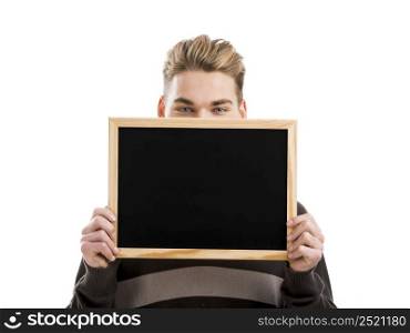 Good looking young man holding a chalkboard