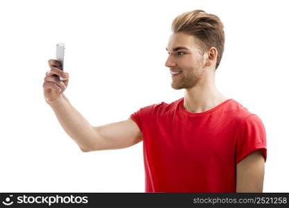 Good looking young man taking a selfie with his cell phone