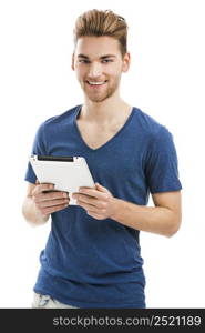 Good looking young man working on a tablet, isolated on white background