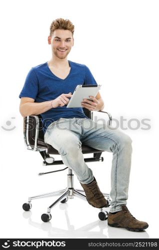 Good looking young man working on a tablet, isolated on white background