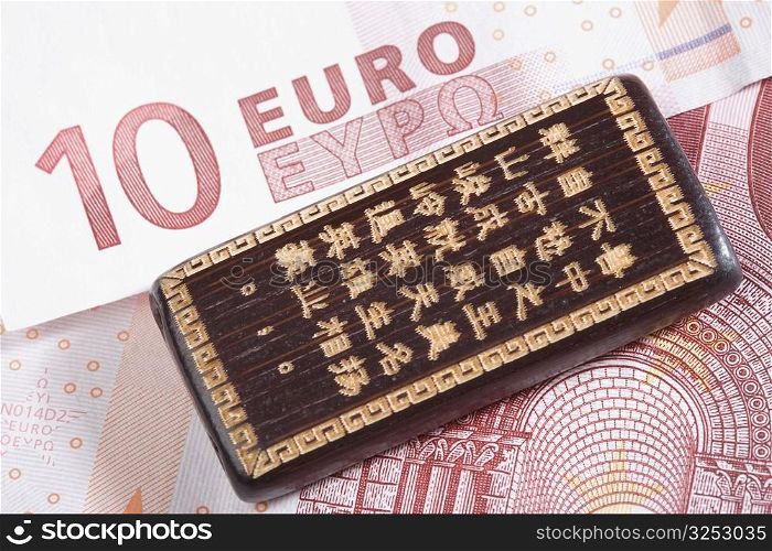 Good luck Chinese hand carved bamboo on a ten euro banknote